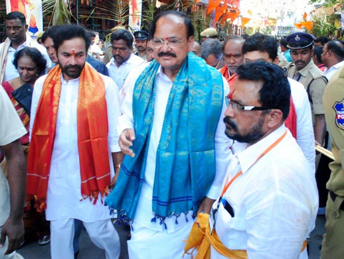 Union Minister Venkaiah Naidu and BJP Telangana unit president G Kishan Reddy arriving at Secunderabad Ujjaini Mahankali Temple on Sunday. Photo: Srinivas Setty